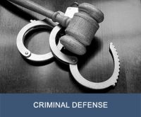 Gavel and handcuffs with text "criminal defense" on bottom