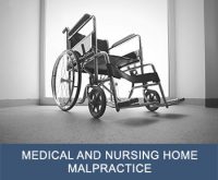 Empty wheelchair with text "medical and nursing home malpractice" on bottom