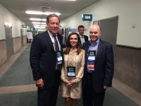Larry Maria and Mark in an office hallway