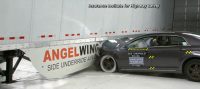 Test car crashing into a truckside guard