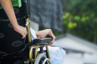 Closeup of elderly lady's arm in a wheelchair